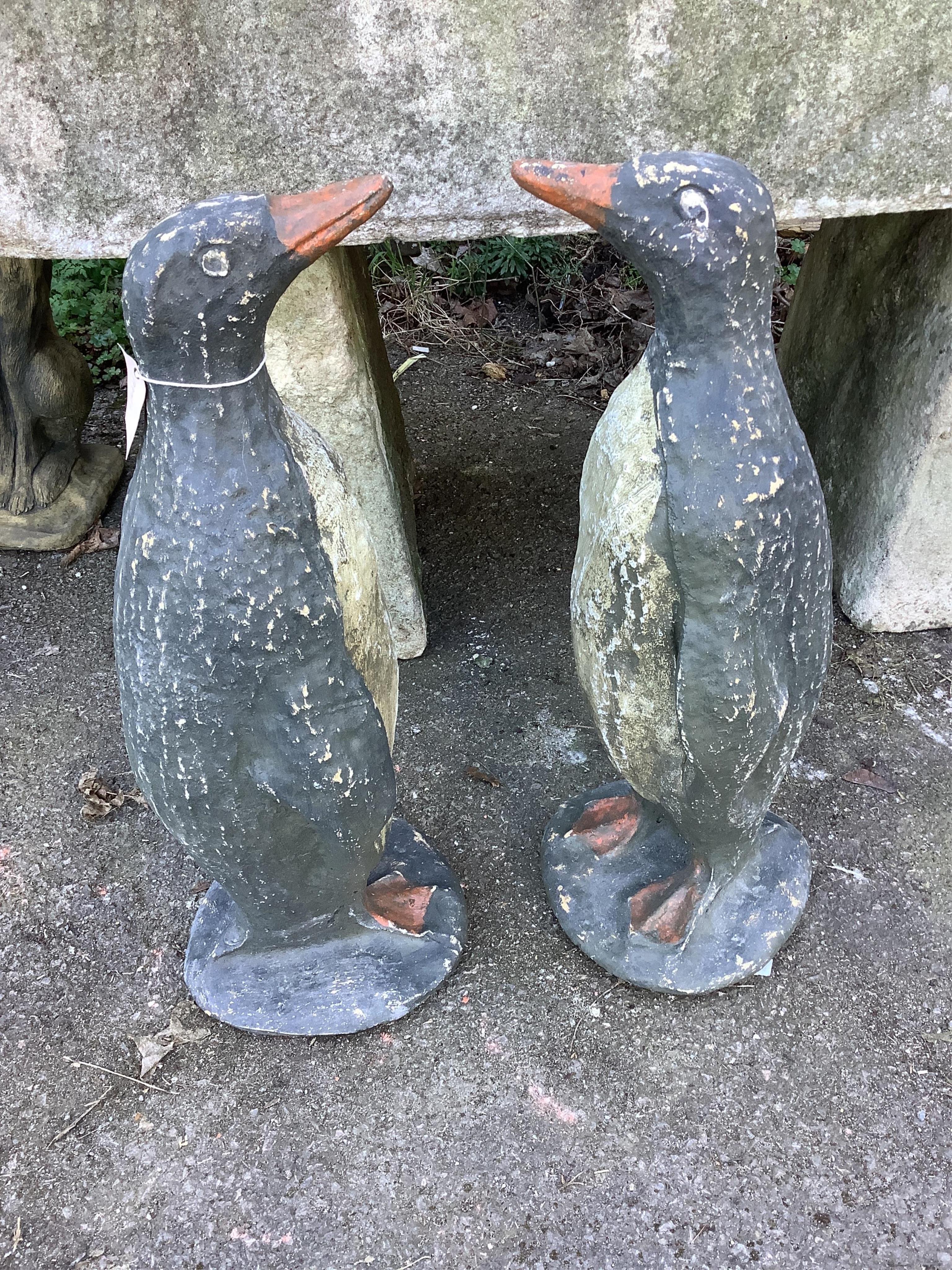 A pair of cast penguin garden ornaments, height 65cm. Condition - fair